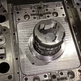 Injection mold for undulating piston shell
